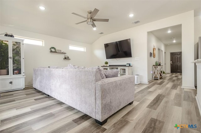 living area with recessed lighting, visible vents, light wood-style flooring, ceiling fan, and baseboards