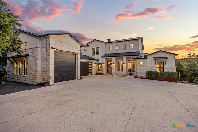 modern farmhouse style home with a garage