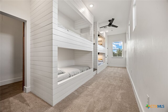 bedroom featuring light carpet