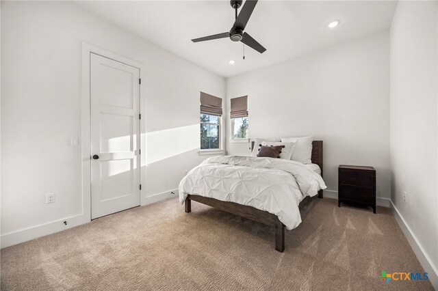 carpeted bedroom featuring ceiling fan