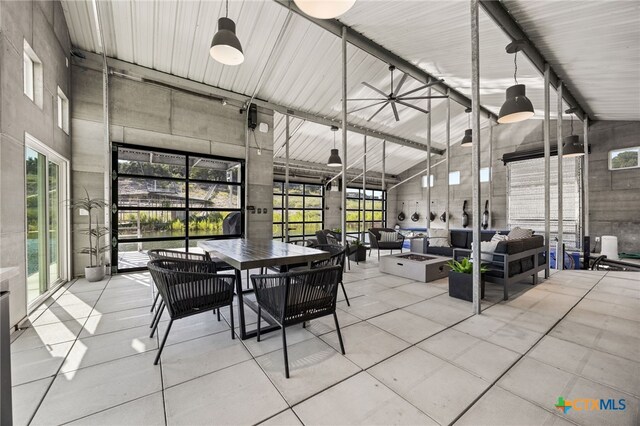 dining room with high vaulted ceiling and ceiling fan