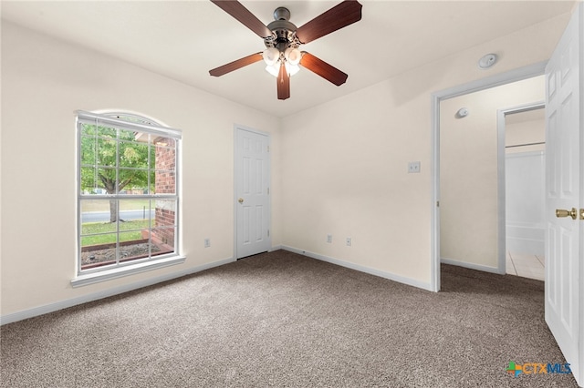 unfurnished bedroom featuring carpet floors and ceiling fan