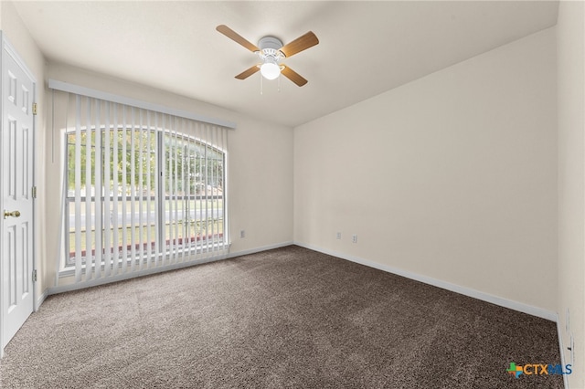 carpeted empty room featuring ceiling fan