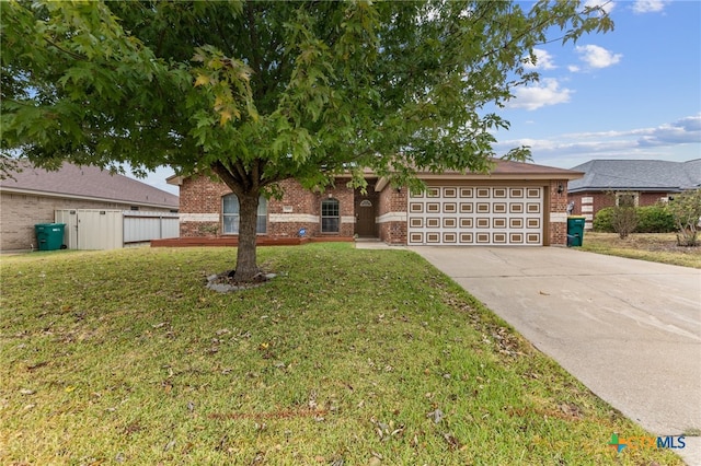 view of front facade with a garage and a front lawn