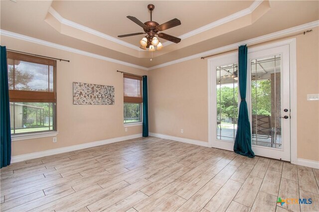 4360 Flint Oak Dr, Belton, TX 76513 - unfurnished room featuring a tray ceiling, healthy amount of natural light, light wood finished floors, and ornamental molding