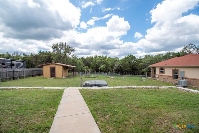 4360 Flint Oak Dr, Belton, TX 76513 - view of yard with a storage unit, central AC, and an outbuilding