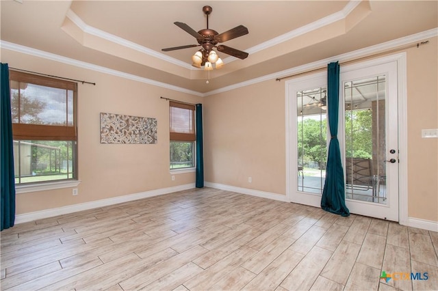 4360 Flint Oak Dr, Belton, TX 76513 - spare room with a tray ceiling, plenty of natural light, wood finished floors, a ceiling fan, and ornamental molding