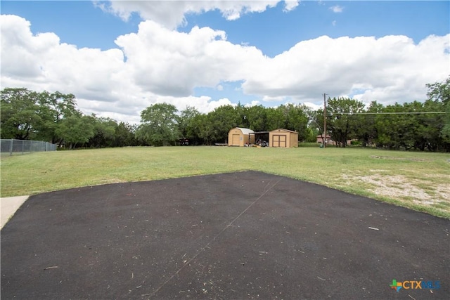 4360 Flint Oak Dr, Belton, TX 76513 - view of patio / terrace featuring a storage shed, an outdoor structure, and view of wooded area