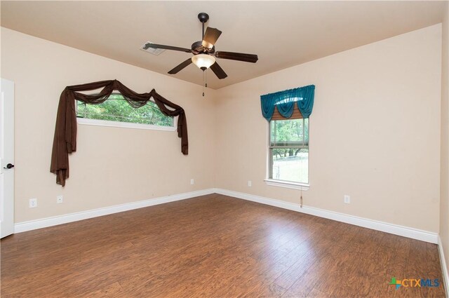4360 Flint Oak Dr, Belton, TX 76513 - empty room with dark wood finished floors, a ceiling fan, and baseboards
