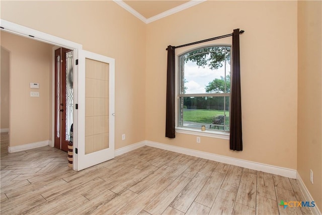 4360 Flint Oak Dr, Belton, TX 76513 - empty room with crown molding, plenty of natural light, baseboards, and light wood-style floors