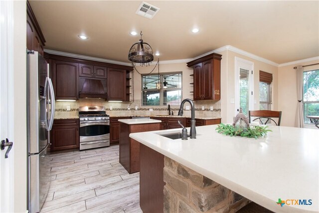 4360 Flint Oak Dr, Belton, TX 76513 - kitchen featuring stainless steel appliances, a center island with sink, ornamental molding, a sink, and premium range hood