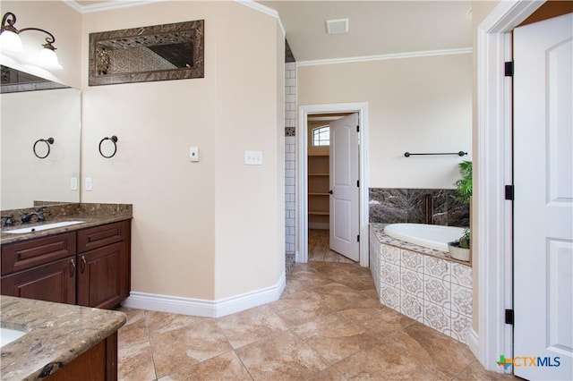 4360 Flint Oak Dr, Belton, TX 76513 - bathroom featuring ornamental molding, vanity, a bath, and baseboards