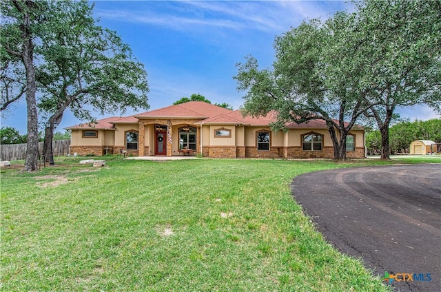 4360 Flint Oak Dr, Belton, TX 76513 - mediterranean / spanish house with stucco siding, stone siding, and asphalt driveway