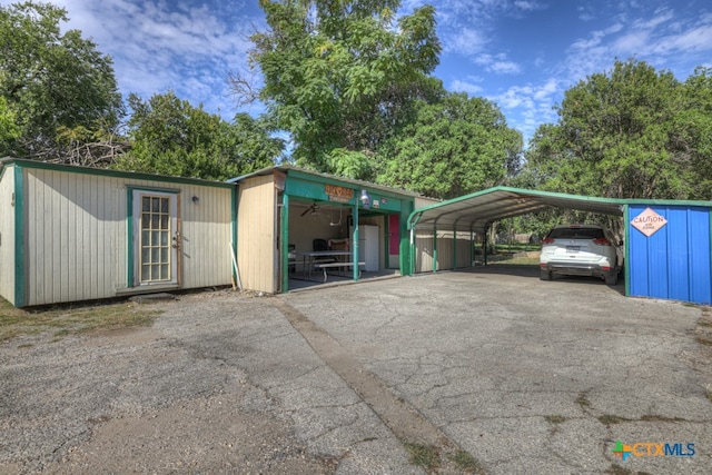 exterior space featuring a carport