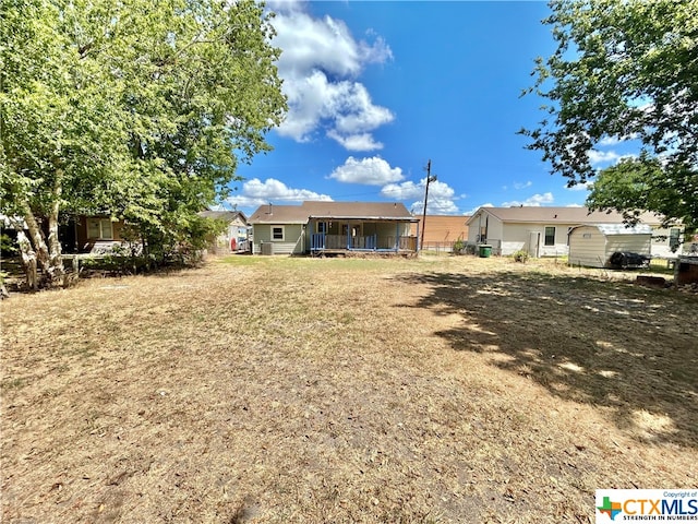 back of property with covered porch