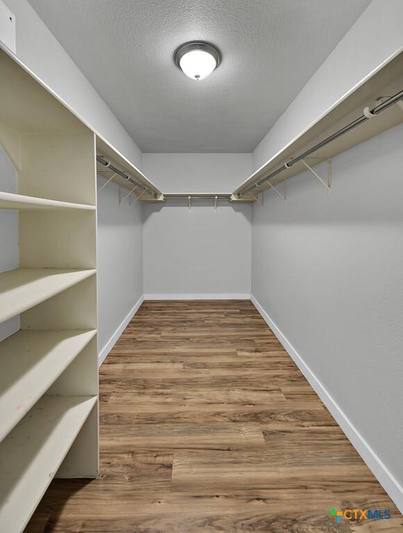 309 Fallen Leaf Ln, Temple, TX 76502 - spacious closet with wood finished floors
