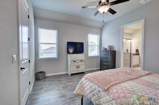 bedroom with connected bathroom and ceiling fan