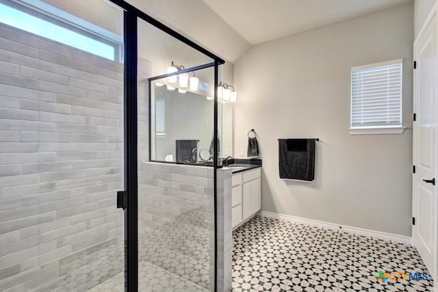 bathroom featuring vanity and an enclosed shower