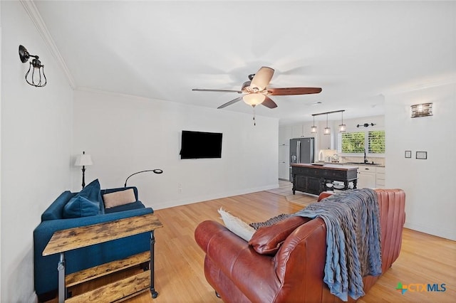 801 Arrowhead Dr, Salado, TX 76571 - living area with a ceiling fan, light wood-style floors, ornamental molding, and baseboards