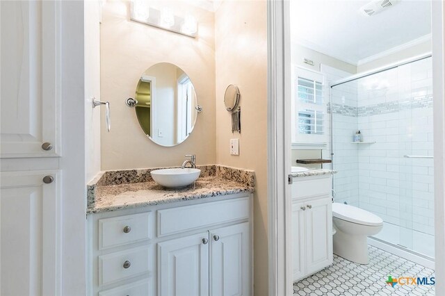 801 Arrowhead Dr, Salado, TX 76571 - bathroom featuring vanity, a shower stall, toilet, and crown molding