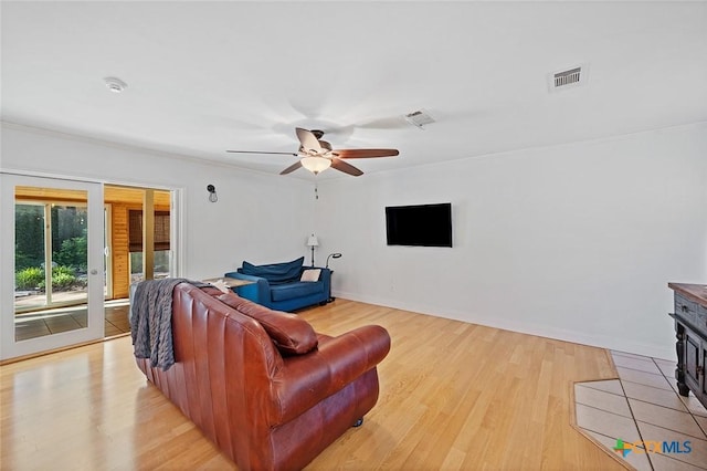 801 Arrowhead Dr, Salado, TX 76571 - living area featuring light wood-style flooring, a ceiling fan, ornamental molding, and baseboards