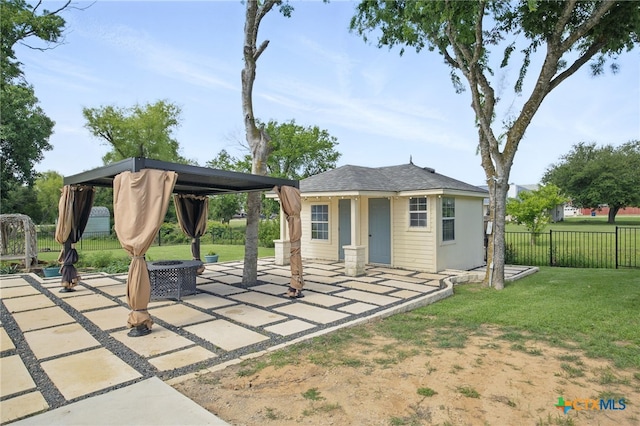 20904 Apache Plum Ln, Pflugerville, TX 78660 - view of patio featuring a gazebo, an outdoor structure, and an outdoor fire pit