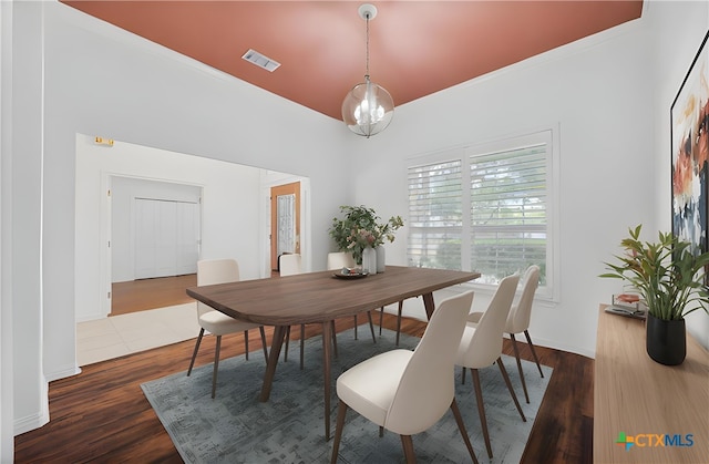 20904 Apache Plum Ln, Pflugerville, TX 78660 - dining room with dark wood-style flooring
