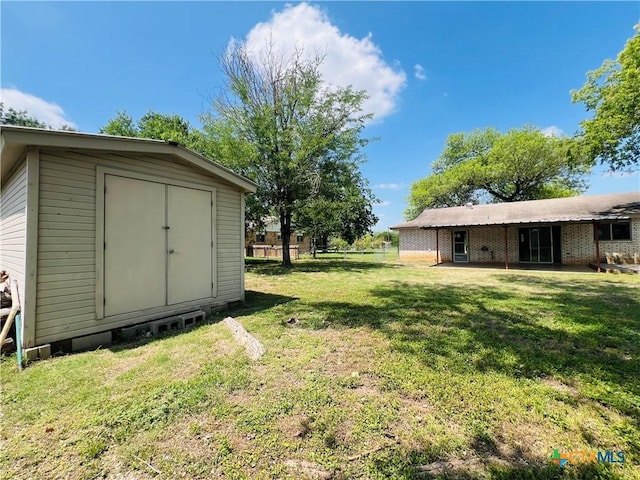 212 Brook St, Seguin, TX 78155 - view of yard featuring a storage unit