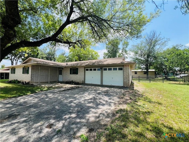 212 Brook St, Seguin, TX 78155 - ranch-style house with brick siding, a garage, and driveway
