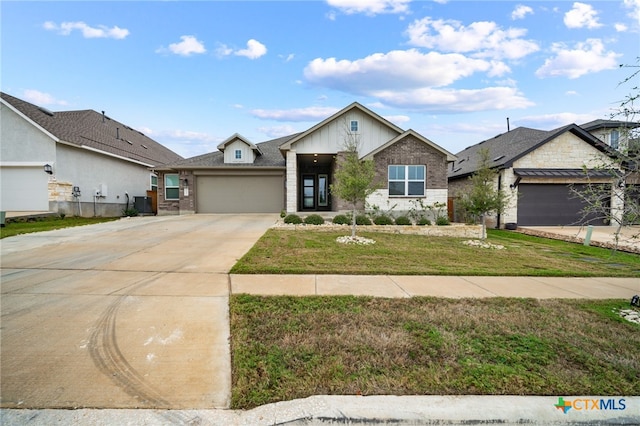 view of front facade featuring driveway, a garage, a front lawn, and brick siding