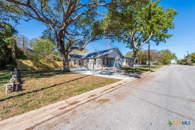 ranch-style house with a front lawn