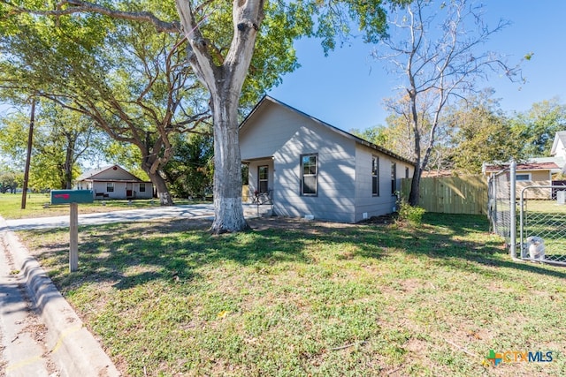 view of home's exterior featuring a yard