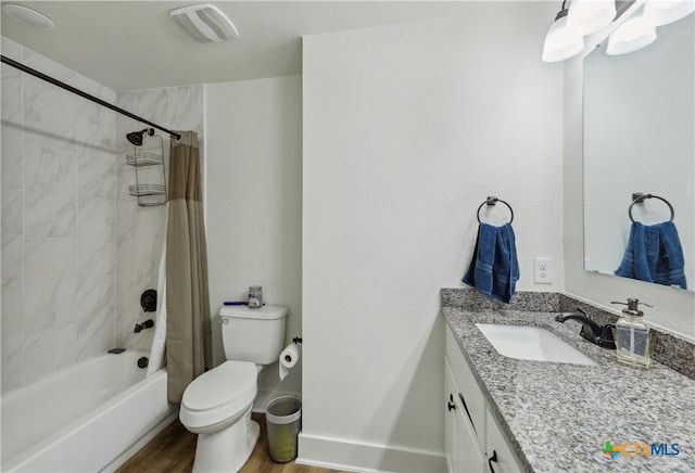 full bath featuring visible vents, toilet, shower / tub combo, vanity, and wood finished floors