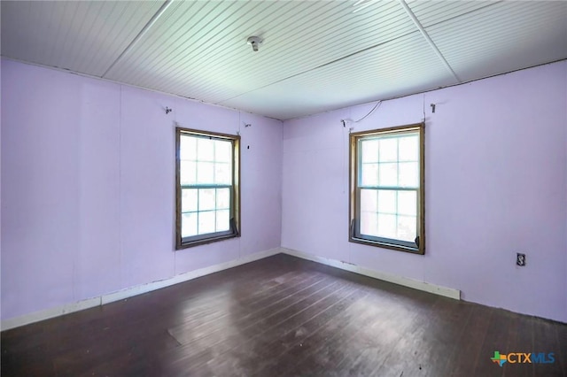 709 Burkett St, Taylor, TX 76574 - empty room featuring plenty of natural light and wood finished floors