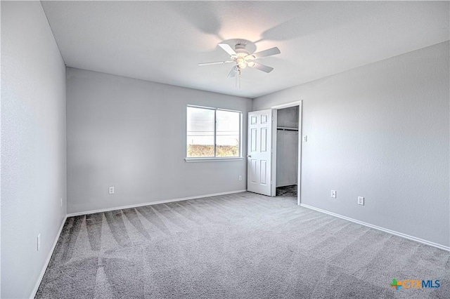 unfurnished bedroom featuring ceiling fan and light colored carpet