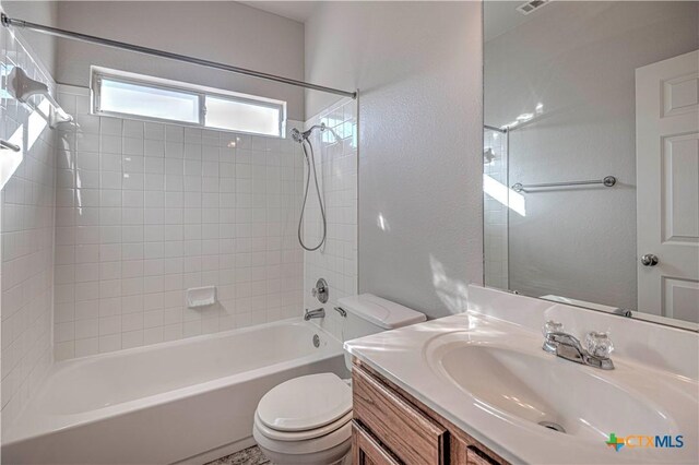 full bathroom with vanity, shower / bath combination, and toilet