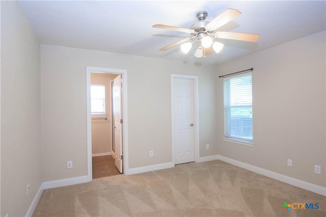 2210 Addax Trl, Harker Heights, TX 76548 - unfurnished bedroom featuring light colored carpet and a ceiling fan