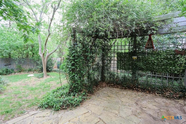view of patio / terrace featuring fence