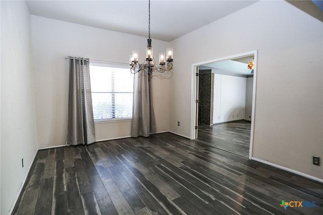 unfurnished dining area featuring baseboards, a notable chandelier, and dark wood-type flooring