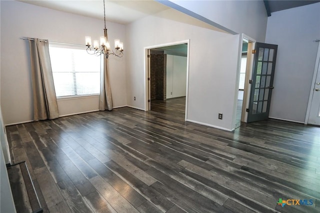 unfurnished dining area with baseboards, a notable chandelier, and dark wood-type flooring