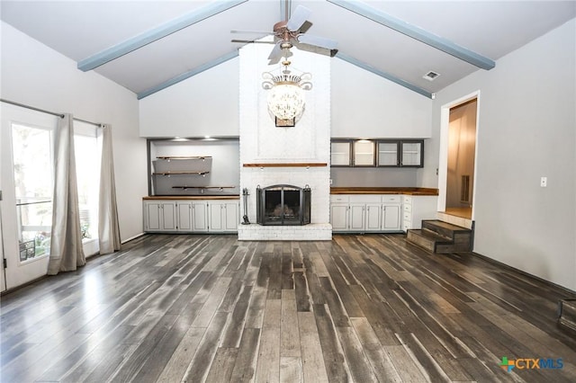 unfurnished living room with beamed ceiling, visible vents, high vaulted ceiling, and dark wood-type flooring