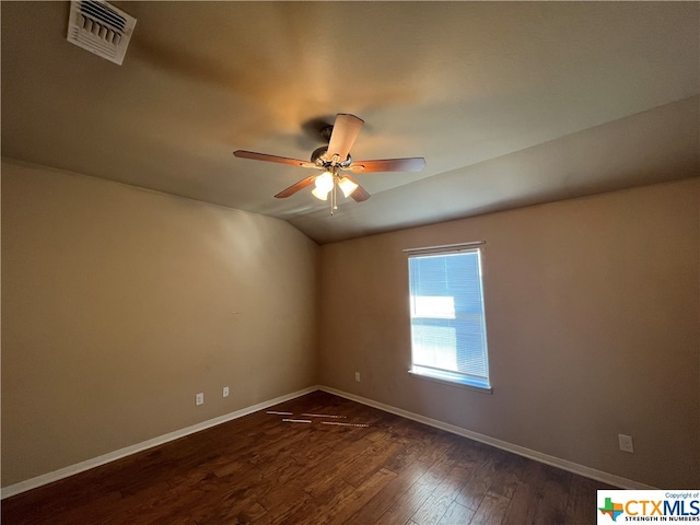 unfurnished room featuring dark hardwood / wood-style flooring, lofted ceiling, and ceiling fan