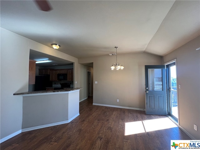 kitchen with black appliances, decorative light fixtures, dark wood-type flooring, and an inviting chandelier