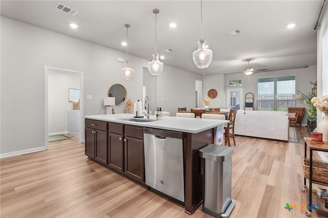 kitchen with visible vents, dark brown cabinetry, ceiling fan, a sink, and dishwasher