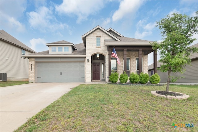 traditional home with a front yard, brick siding, central AC unit, concrete driveway, and an attached garage
