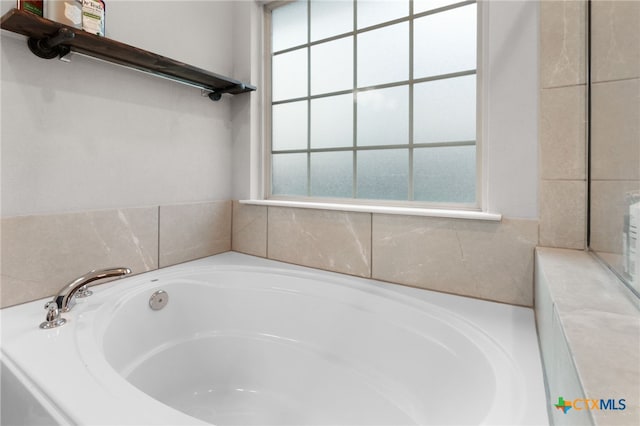 full bathroom featuring a garden tub
