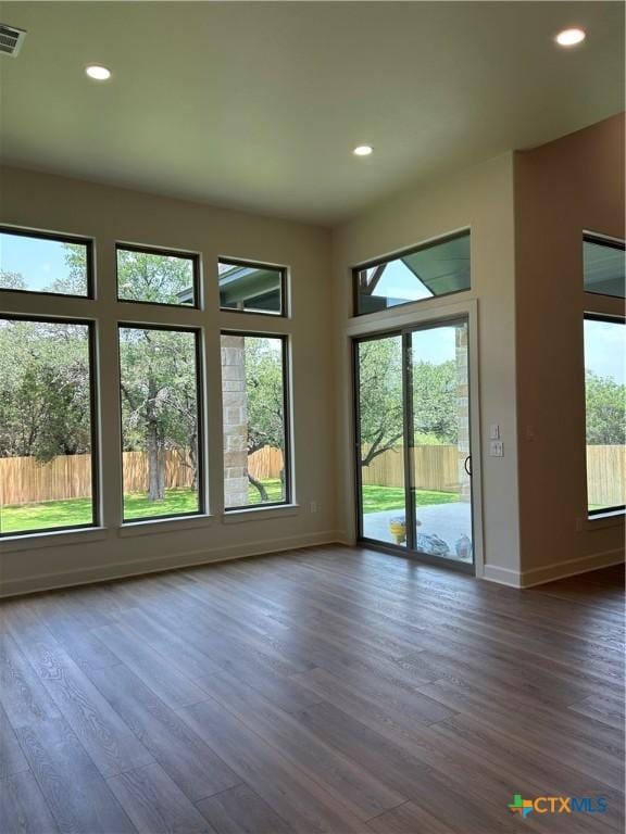 5903 Whippoorwill Rd, Temple, TX 76502 - unfurnished living room featuring dark wood-style floors and recessed lighting