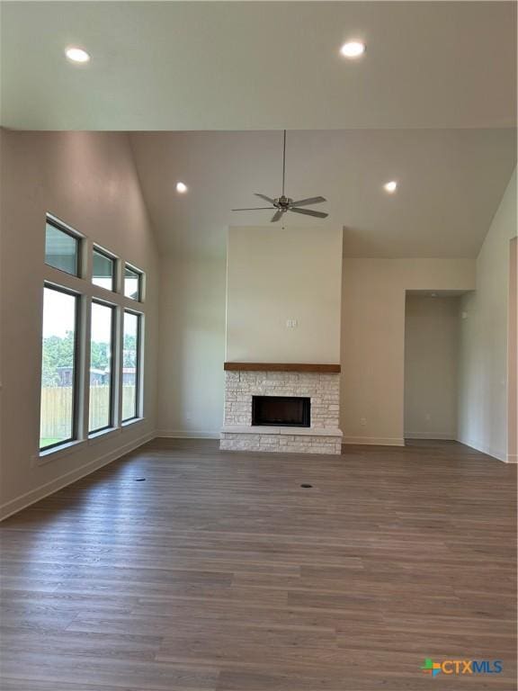 5903 Whippoorwill Rd, Temple, TX 76502 - unfurnished living room with wood finished floors, ceiling fan, a stone fireplace, high vaulted ceiling, and recessed lighting