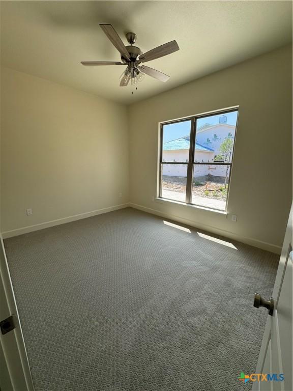 5903 Whippoorwill Rd, Temple, TX 76502 - carpeted empty room featuring baseboards and a ceiling fan