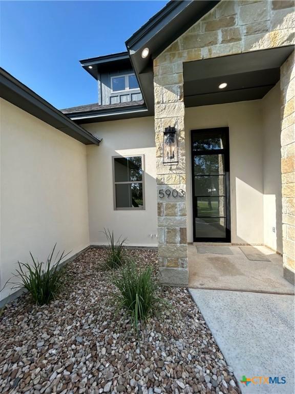 5903 Whippoorwill Rd, Temple, TX 76502 - property entrance featuring stone siding and stucco siding
